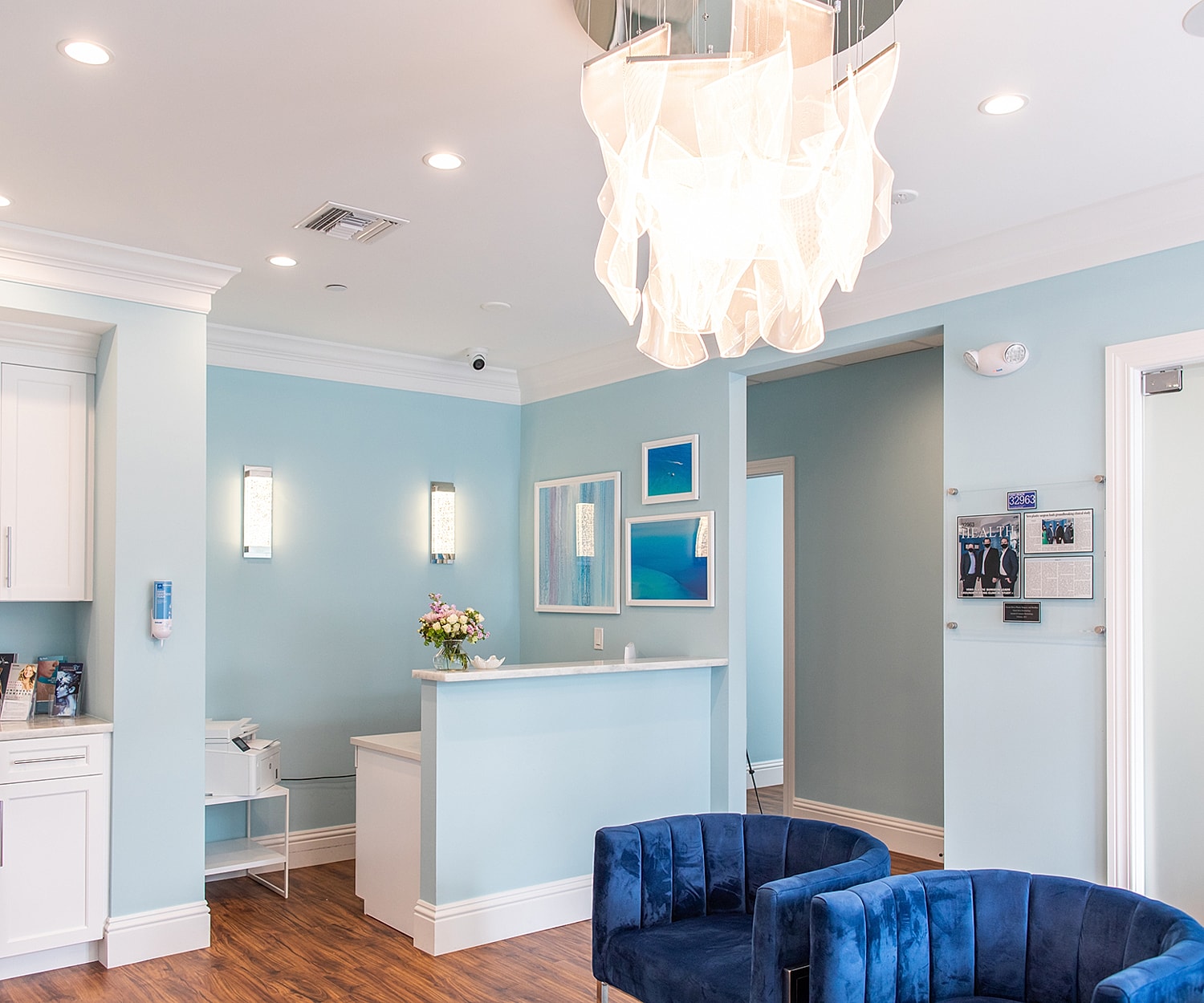 Bright, modern reception area with blue accents.