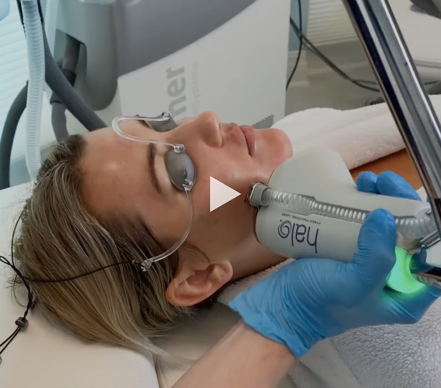 Facial treatment procedure in a skincare clinic.