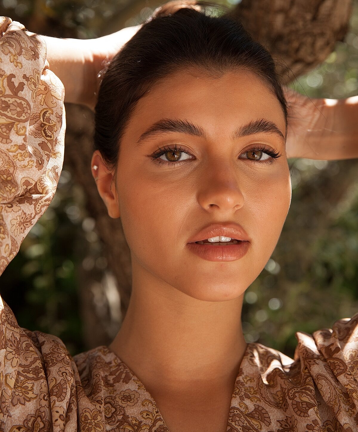 Smiling woman relaxing in a hammock.