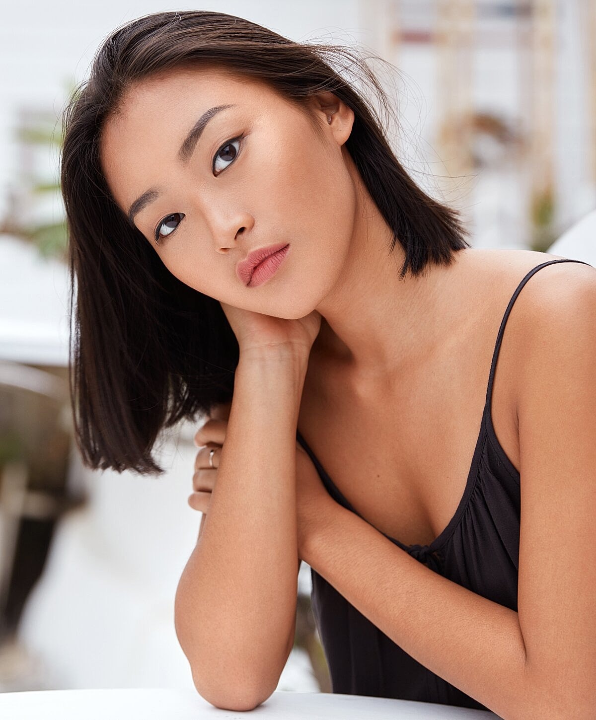 Portrait of a woman with long wavy hair.