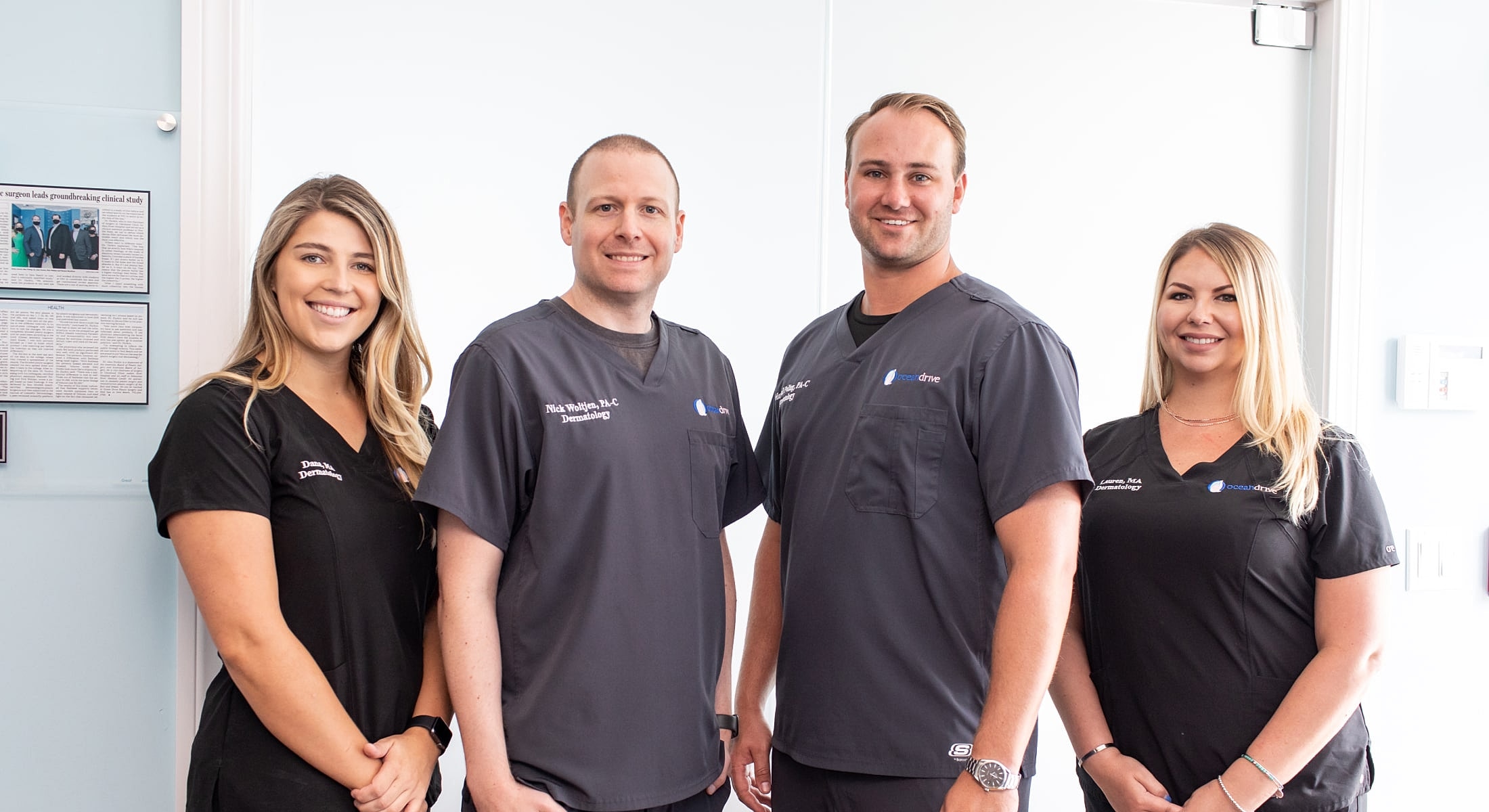Medical professionals posing in clinic attire.