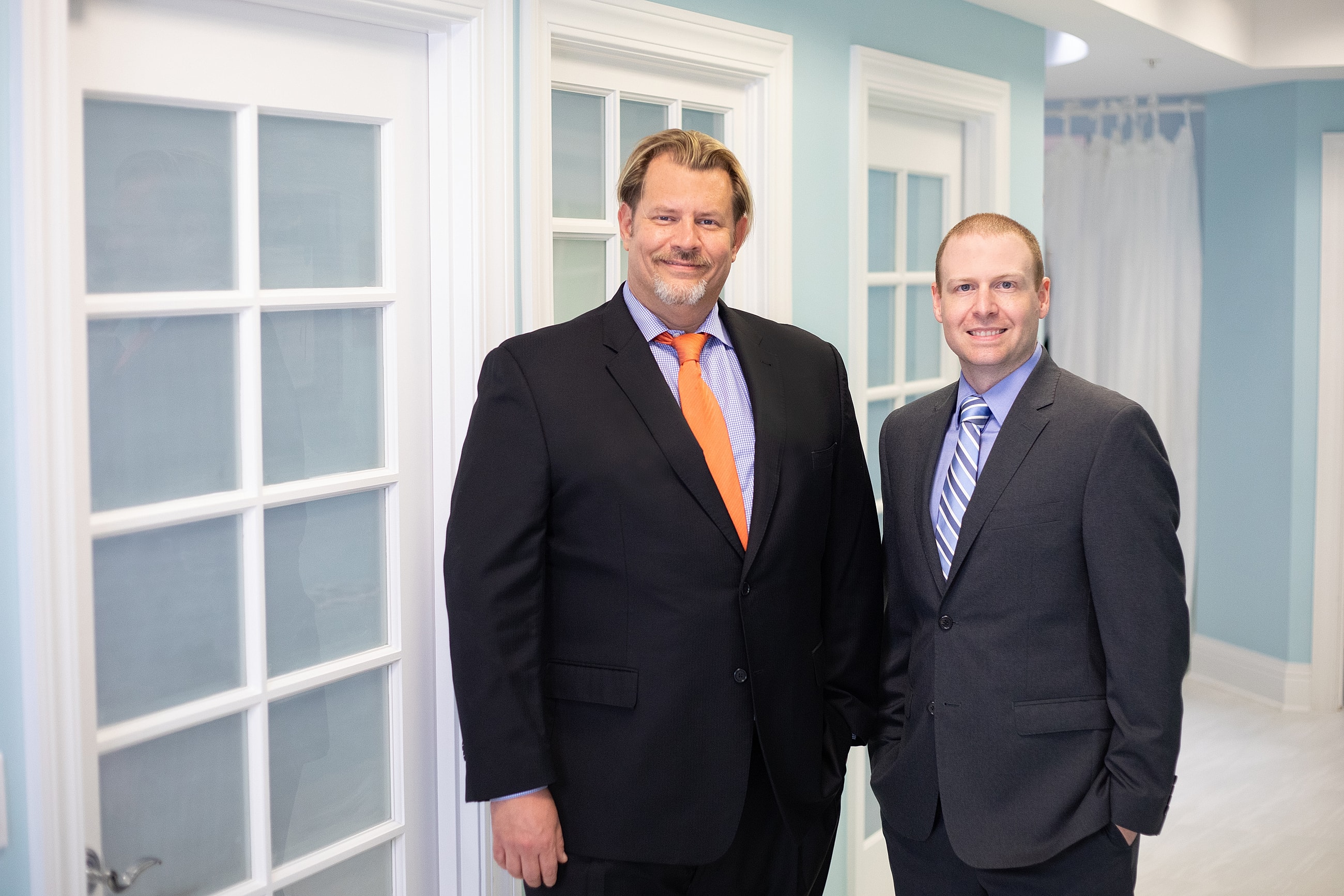 Medical professionals posing in a clinic setting.
